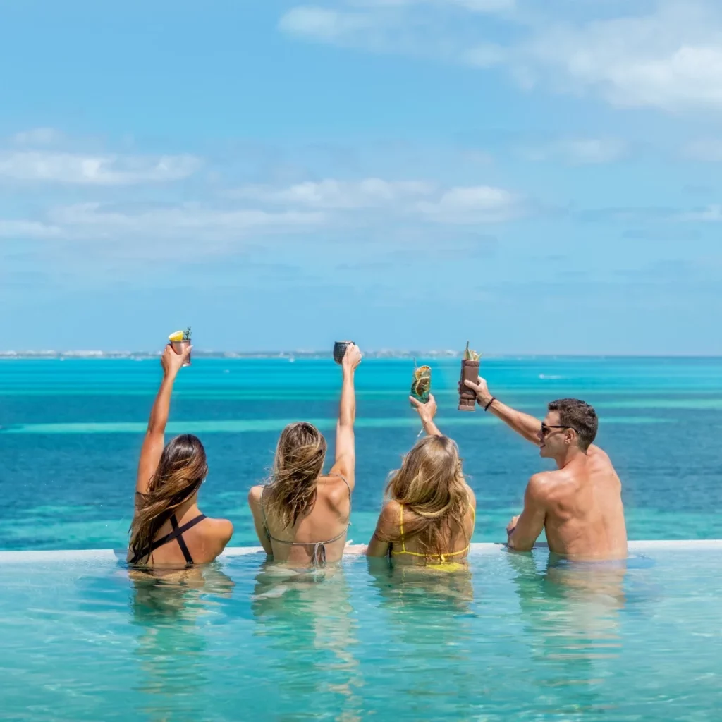 Garza Blanca guests enjoying drinks at the pool